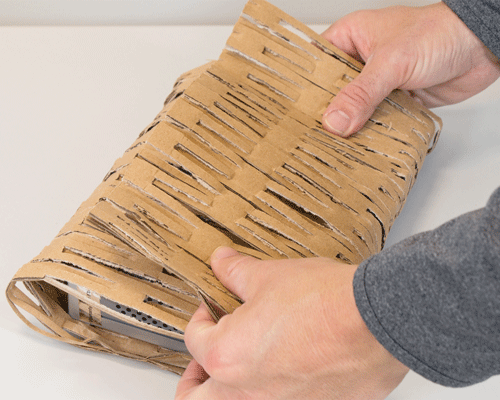 Produce flexible cardboard webbing which is easy to wrap around items for shock-absorbing protection in transit